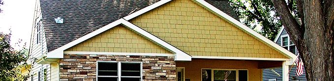 Close Up Image of Yellow and Brick House